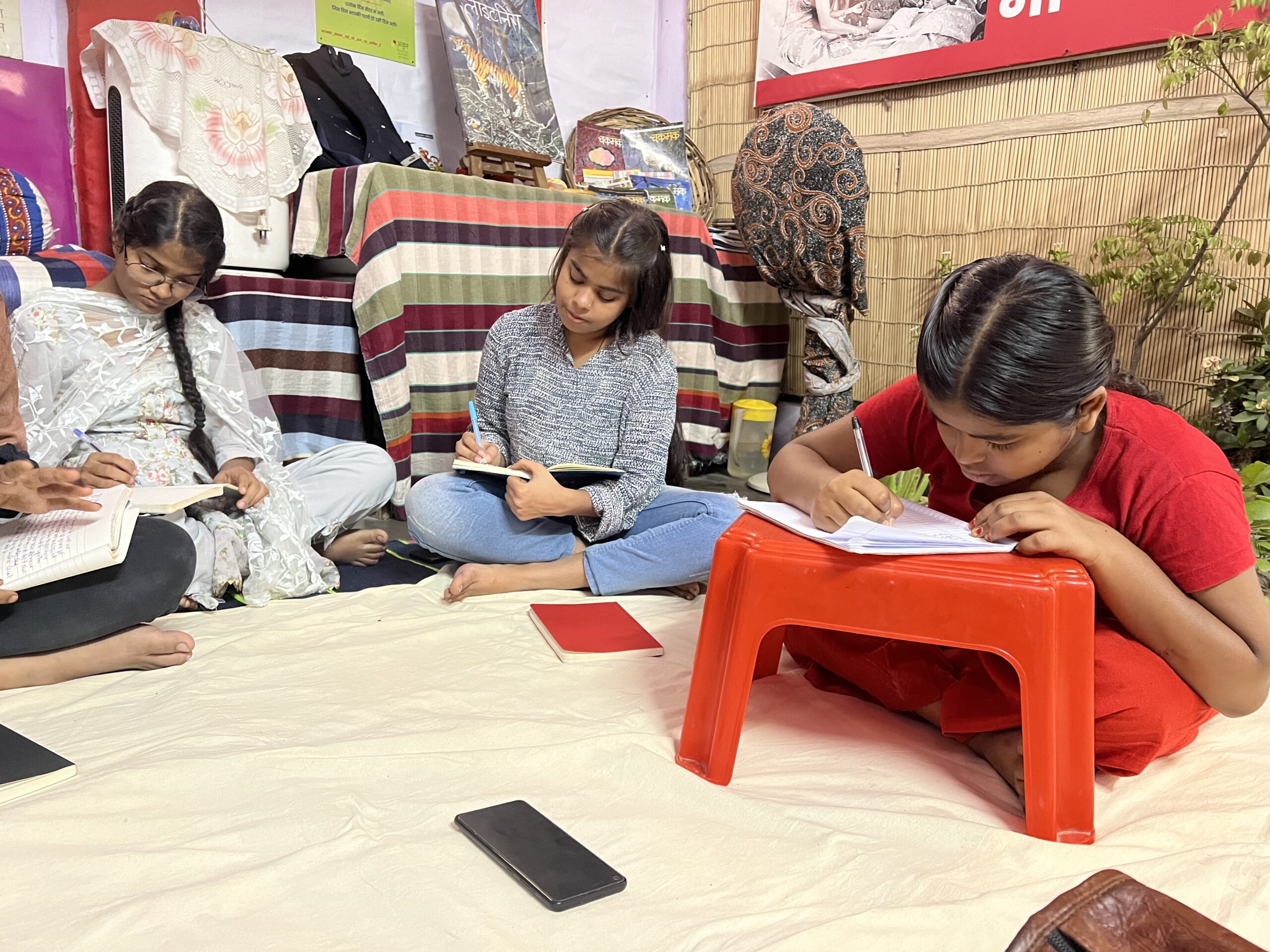 Writers at work at Khichripur Ankur center. Photo: Kavita Dasgupta 2002.