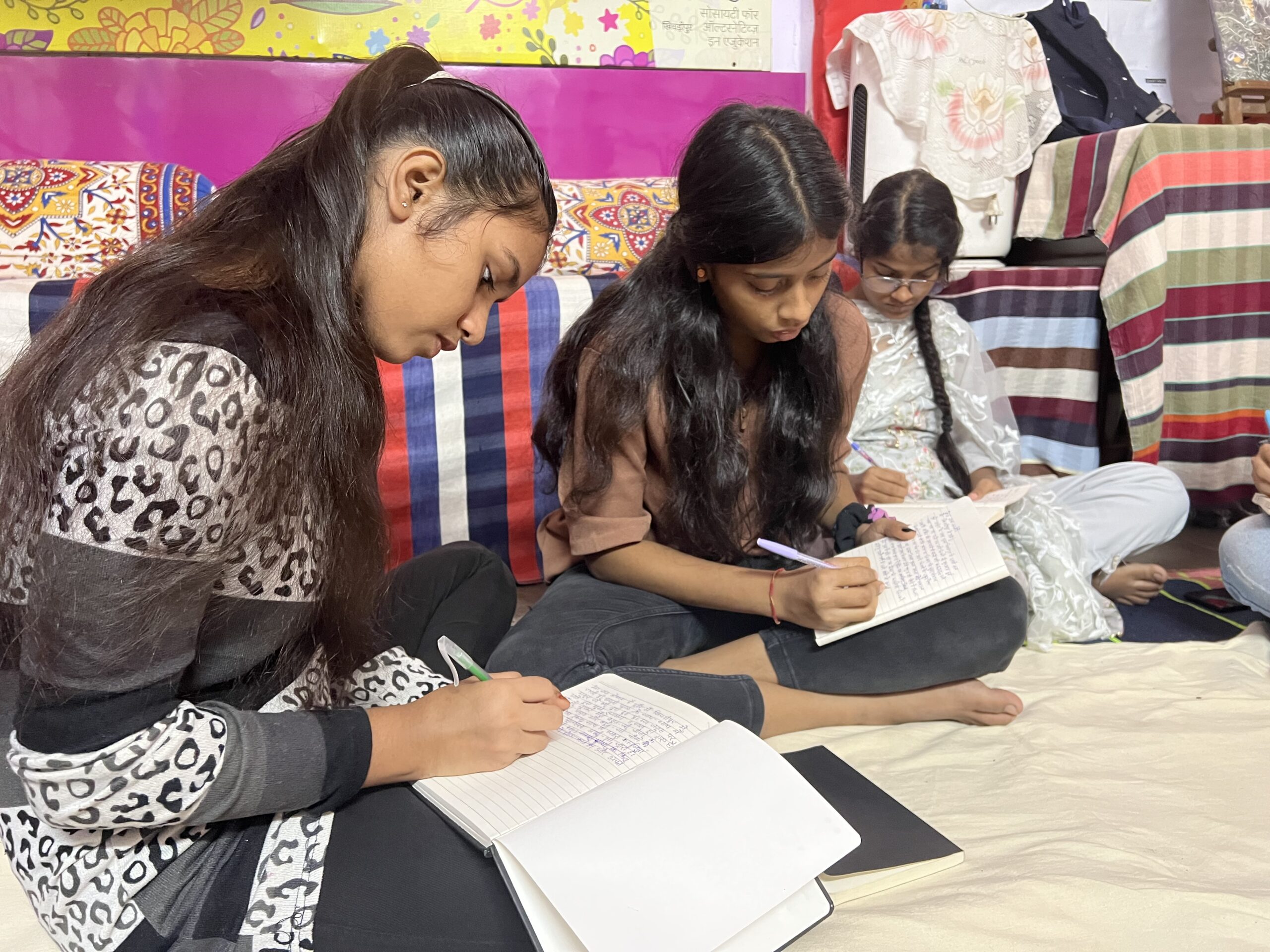 Komal, Nandini & Tahreen writing at Khichripur Ankur center. Photo: Kavita Dasgupta 2002.