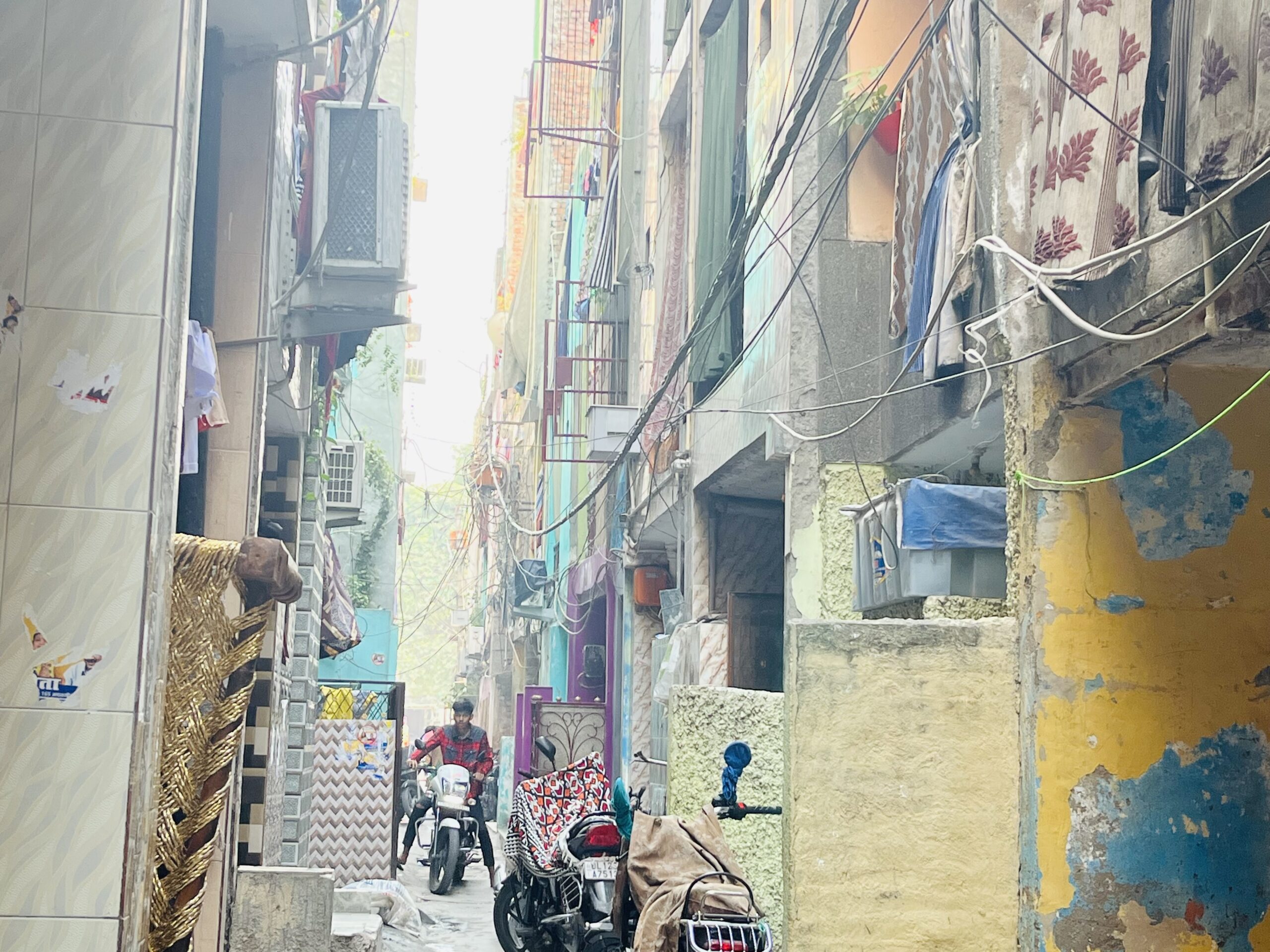 Lane with a bike@Dakshinpuri JJ Colony. Localities. Photo: Kavita Dasgupta