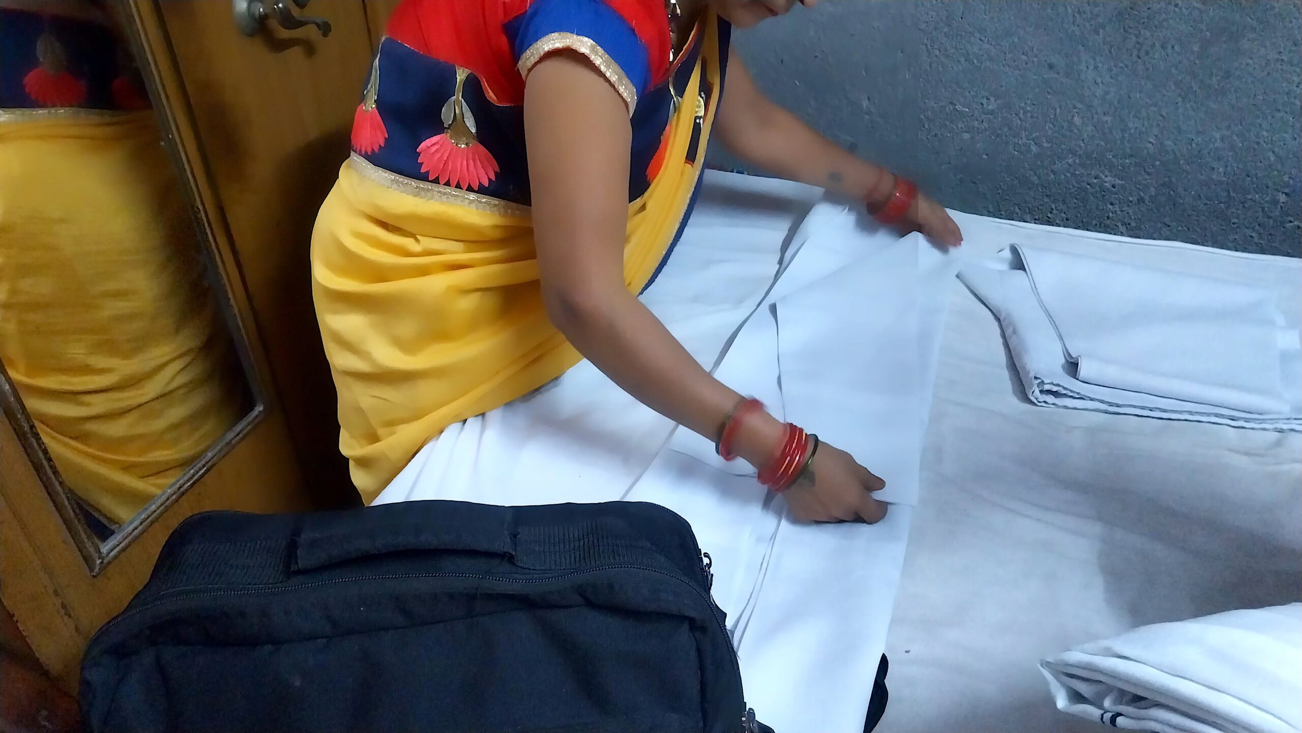 Gayatri folded and ironed the white kurta meticulously every day after she had washed and dried them. Gayatri folded and ironed the white kurta meticulously every day after she had washed and dried them.